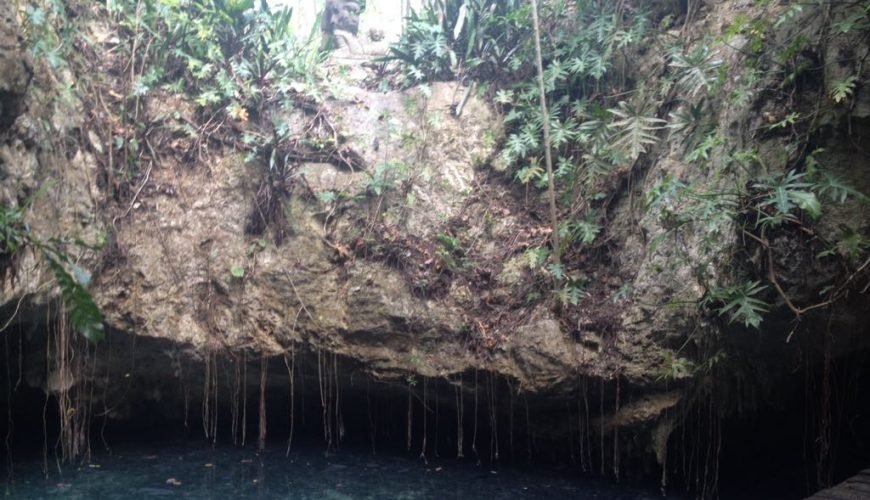 Cenote with clear water. Stand-in photo, not Hoyo Azul.